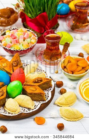 Novruz Ramadan In Azerbaijan. Colored Eggs, Wheat Springs For Easter And Traditional Sweets. Selecti