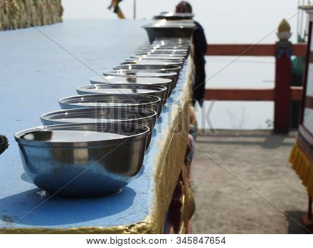 A Series Of Water Bowls On A Straightline