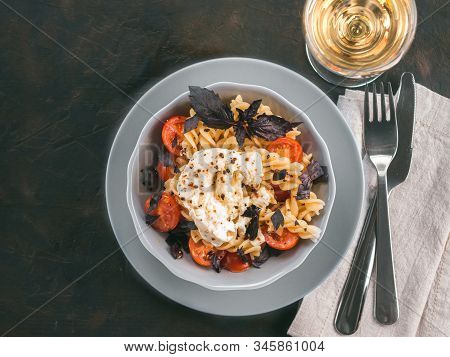 Tasty Italian Fusilli Pasta With Cherry, Mozarella Or Buratta Cheese And Fresh Basil. Dish With Past