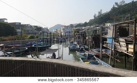 Boats In Tidel Arbor In Chinese Fishing Village
