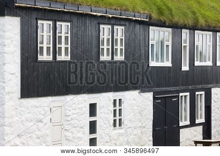 Traditional Faroese Stone And Wooden House With Green Rooftop. Faroe