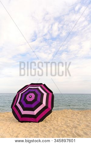 Vacation with shade with umbrella at the beach