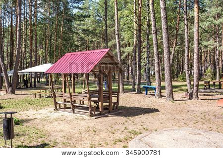 Wooden Camping Arbors  With All Conviniences In A Pine Forest