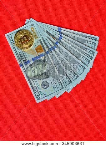 Golden Bitcoin On Usd 100 Billnote Dollar Background. Finance Concept.