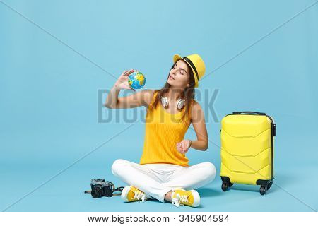 Traveler Tourist Woman In Yellow Casual Clothes, Hat With Suitcase Photo Camera Isolated On Blue Bac