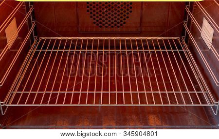 A Close View Inside An Empty  Hot Operational Household Oven - 3d Render
