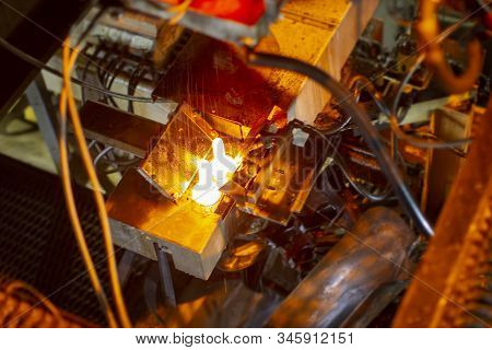 Glassworks. Glass Industry. Burning Blanks Of Glass Bottles In An Industrial Stove