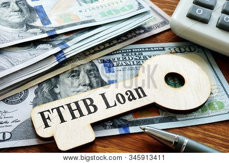 First-time Homebuyer Fthb Loan Printed On The Wooden Key.