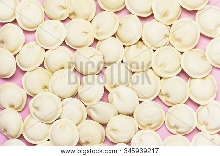 Uncooked Russian Pelmeni On Pink Background Homemade Pelmeni Ravioli Or Dumplings With Meat Top View