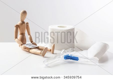 Composition With Anoscope On White Background. Hemorrhoid Treatment