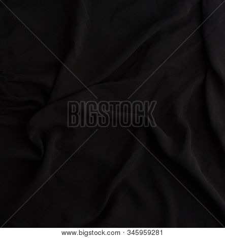 Texture Of Black Synthetic Fabric With Waves, Full Frame, Fabric For Sewing Clothes, Shirts. Design 