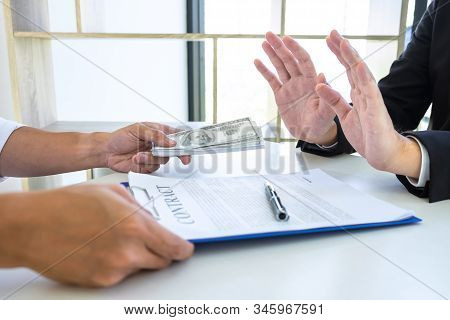 Businessman Refusing Receive Bribe Money In The Envelope Of Their Partner To Give Success The Deal C