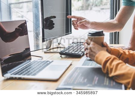 Two Professional Programmer Cooperating And Working On Web Site Project In A Software Developing On 