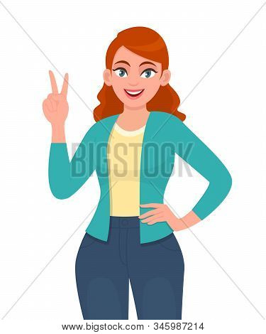Portrait Of Young Trendy Woman Showing Victory, V, Two Or Peace Sign With Fingers. Girl Gesturing Wi