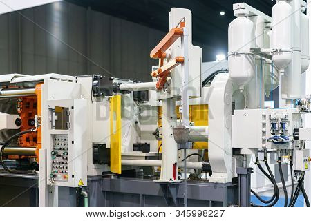 Close Up Ladle & Mechanical Arm Of Automatic High Pressure Aluminum Die Cast Machine & Air Tank Hydr