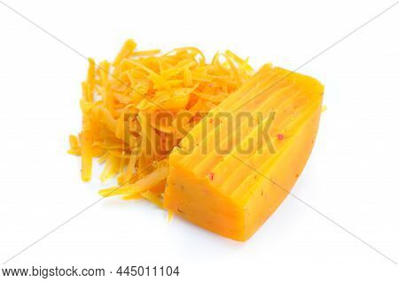 Chunk Of Cheese And Pile Of Grated Cheese Isolated On White
