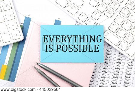Everything Is Possible Text On Blue Sticker On Chart With Calculator And Keyboard,business