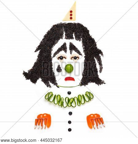A Creative Food Concept Of A Crying Dramatic Pierrot Made Of Vegetables And Fruits.