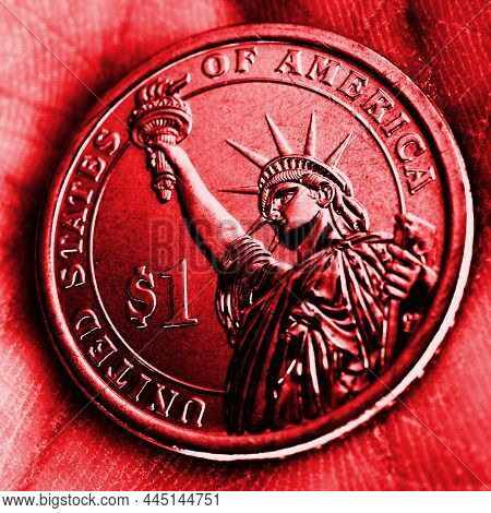 American Coin Lies In The Palm. 1 Dollar Close-up. Red Square Tinted Illustration In Republican Part