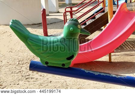 Children Playground, Plastic Bird Seesaw, Teeter Totter Or Teeterboard In Outdoor Park.