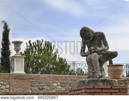 Sculpture Of A Boy Sitting While Removing A Thorn From The Sole Of His Left Foot In The Quinta Alegr