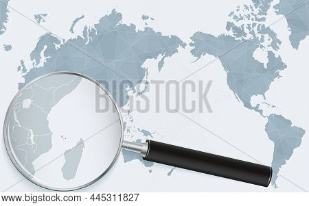 Asia Centered World Map With Magnified Glass On Comoros. Focus On Map Of Comoros On Pacific-centric 