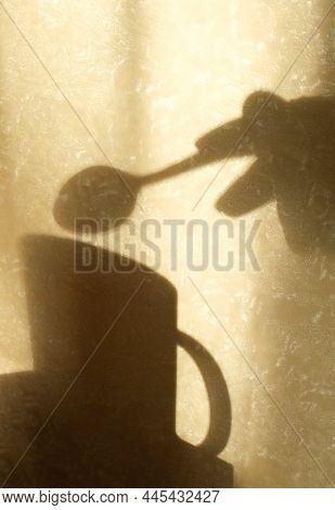 Shadow On Beige Wall With Neutral Pattern,  Cup  And Hand With Spoon, Wabi Sabi Aethetics