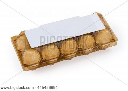 Chicken Eggs In Closed Brown Plastic Transparent Disposable Egg Packaging Tray On A White Background