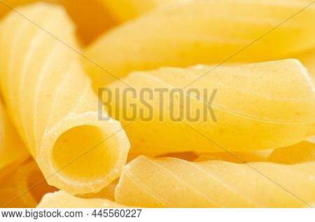 Raw Ziti Pasta. Food Background. An Ingredient For Traditional Italian Food. Closeup