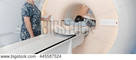 Doctor Or Nurse And Patient With Tomography Ct Or Mri Scan In Hospital. Interior Of Radiography Depa