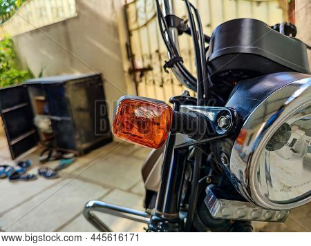 Extreme Close Up Of Motorbikes Headlight And Indicator, Motorbike Parked At Home In The Afternoon At