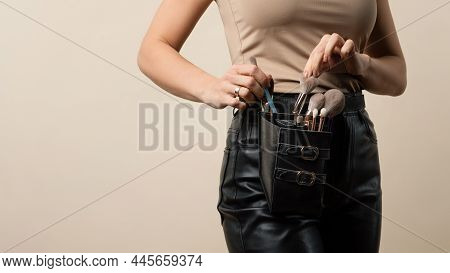 Thigh Bag With Different Brushes On Faceless Professional Makeup Artist. Unrecognizable Make-up Arti