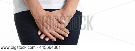 Young Sick Woman Holds Hands Pressing To Perineum To Lower Abdomen. Medical Or Gynecological Health 