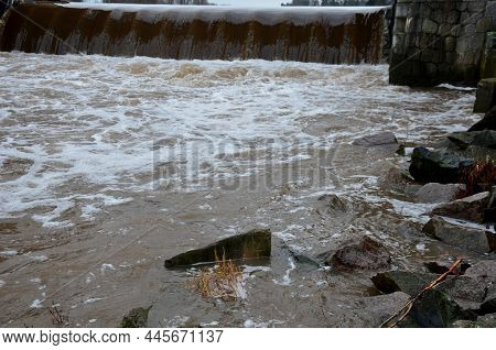 The Turbid Water During The Flood Falls From Large Dams And Forms A Lot Of Foam. A Fish Pass Is A Ne