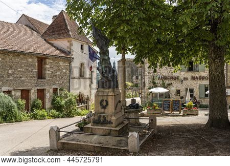 Chateauneuf, France - July 7, 2020: Statue And Terrace In The Village Of Chateauneuf With People Dri
