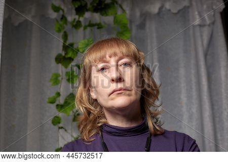 An Inept Photo Of An Ordinary Girl. A Middle-aged Woman In An Indoor Studio. A Picture Of A Selfie O