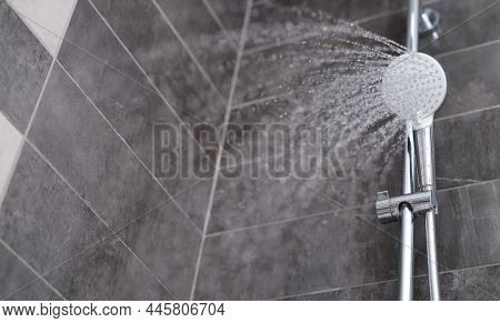 Water Is Pouring From The Shower Head Into The Shower Room, Close-up. Refreshing Shower, Cleanliness