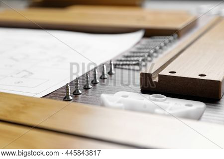 Composition With Furniture Parts And Tools For Self-assembly On Wooden Background, Closeup