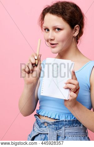 Beautiful Woman Writing In A Red Notebook With A Pen Study Lifestyle Unaltered