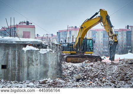 Demolition Of Old Concrete Building. Hydrohammer Crushes Building