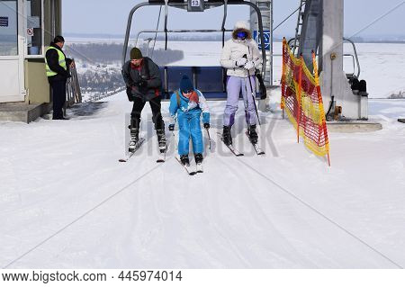 People With Skis Are Skiing In The Winter Snowy Mountains. Ski Lift. Winter Sport, Active Rest Extri