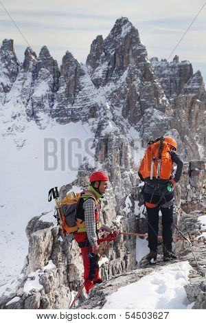 Alpinist climbing ferrata La torre di Toblin (2.617 m), Dolomites, Italy, Europe