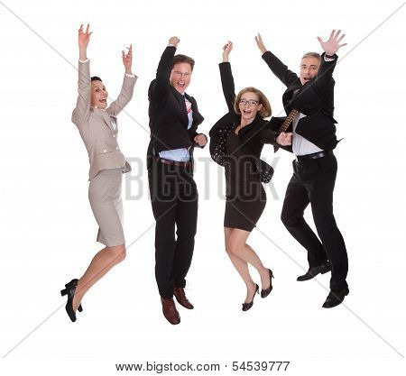 Four Business Partners Jumping For Joy