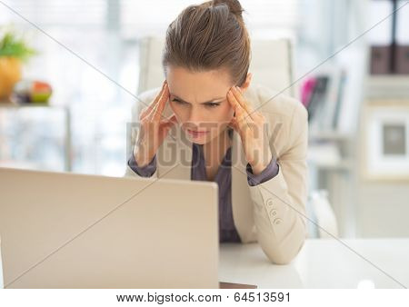 Stressed Business Woman With Laptop At Work