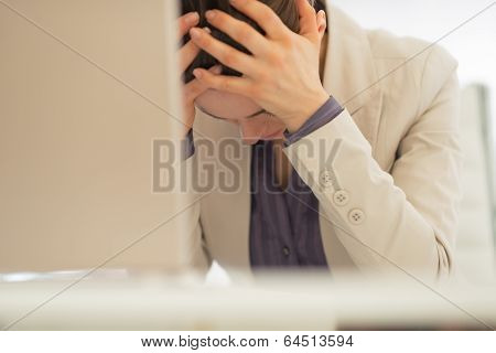 Stressed Business Woman With Laptop At Work