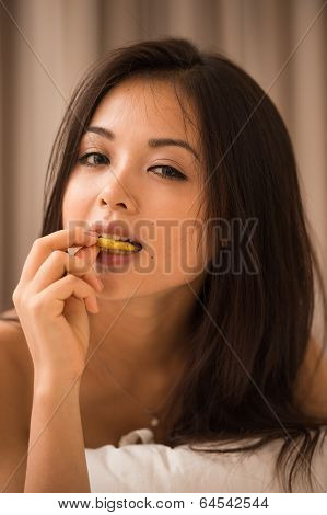 Asian Young Woman Eating Potato