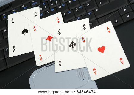 Four Ases on the notebook