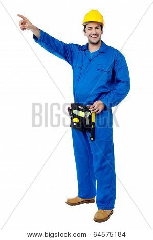 Happy Male Worker Pointing At Something