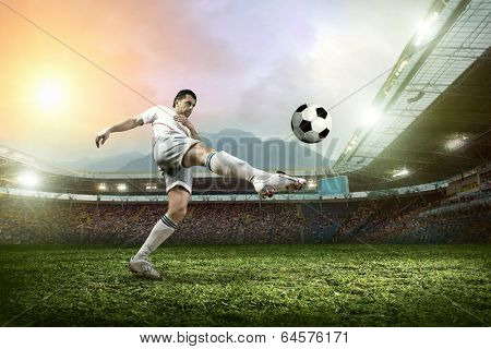 Soccer player with ball in action outdoors.