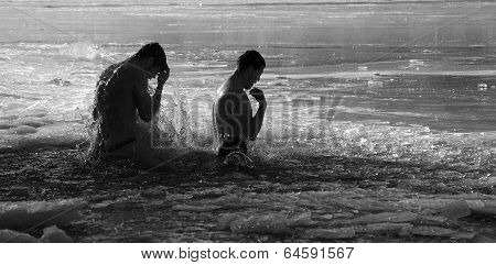 Two Men  Baptized And Dipped In Ice Water In Baptism